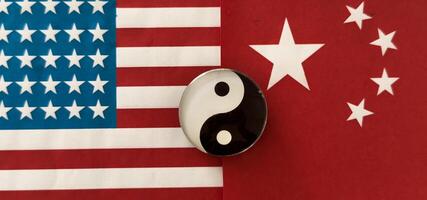 Yin Yang Symbol on flags background photo