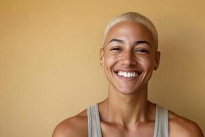 Smiling person with a short haircut against a neutral background photo