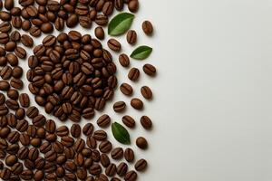 Coffee Beans Arranged Artistically With Green Leaves on a Light Background for a Natural Feel photo