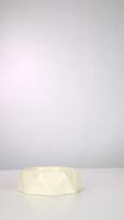 Placing a geometric bowl on white surface with minimalist aesthetic video