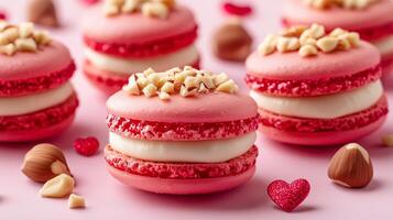 Valentine's Day macrons with red and pink cream, white chocolate filling, and hazelnuts on top. 15 photo