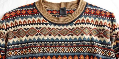 Close-up of a knitted sweater with intricate patterns. photo