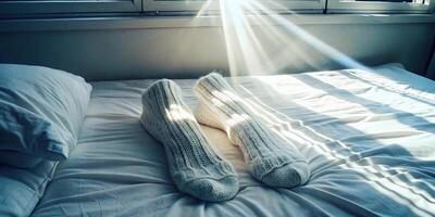 Sunlight streaming onto a cozy bed with soft gray sheets. photo