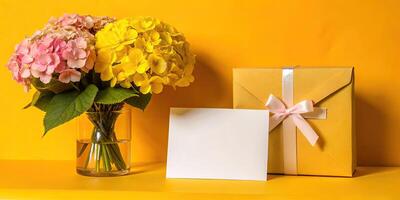 Gift and flowers arranged beautifully on a table. photo
