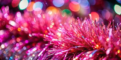Glittering pink tinsel with vibrant highlights. photo