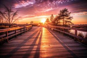 Sunlit boardwalk leading to a tranquil lake. photo
