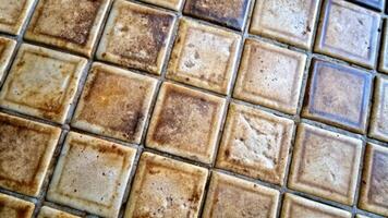 A close-up of textured vintage tiles. photo