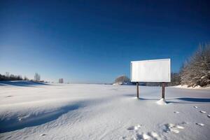 Empty billboard standing in a vast snowy landscape. photo