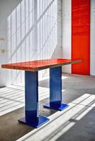 Modern table with a striking red and blue design. photo