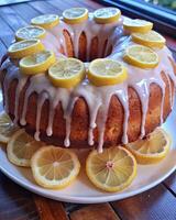 Lemon drizzle cake with slices on top. photo