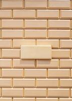 Glossy beige subway tiles create a sleek modern look. photo