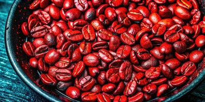 Close-up of freshly harvested bright red coffee beans in a bowl. photo