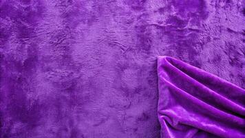 Plush purple fabric with a soft and luxurious texture. photo