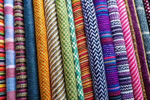Colorful woven textiles with various patterns and textures. photo