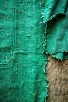 Worn green textured fabric with frayed edges for grunge effect photo