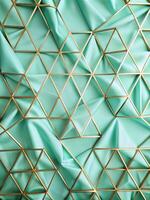 Triangular geometric design with gold accents on a green surface. photo
