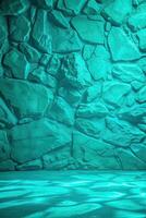 Turquoise stone wall with a textured surface. photo