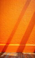 Bold orange wall casting dramatic shadows in sunlight. photo