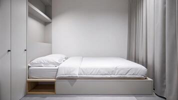 Simple Modern Bedroom with White Linens and Wooden Furniture in Soft Light photo