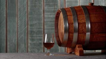 Wooden Wine Barrel with Glass of Red Wine on Rustic Surface photo