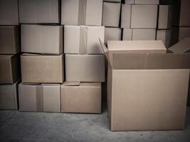 Stacked Cardboard Boxes in Warehouse or Storage Room photo