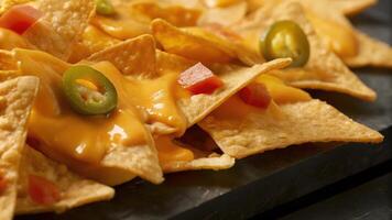 Plate of Nachos with Melted Cheese, Jalapenos, and Salsa photo