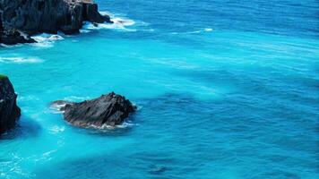 Scenic Turquoise Ocean with Rocky Shoreline photo