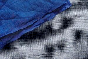 Close-Up of Blue Fabric with Woven Details photo