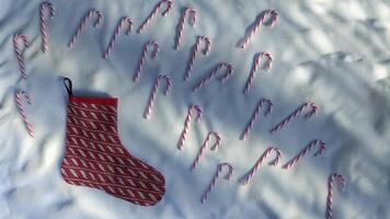 Candy Canes and Holiday Stockings on a Snowy Backdrop photo