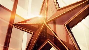 Golden Star Ornament Glowing in Warm Ambient Light photo