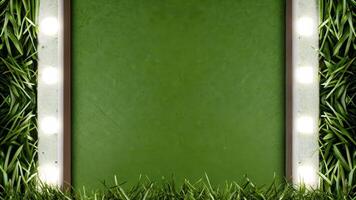 Green Chalkboard Framed with Lights Surrounded by Grass photo