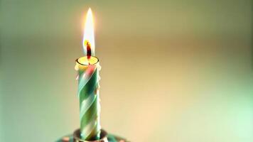 Green Candle with a Burning Flame photo
