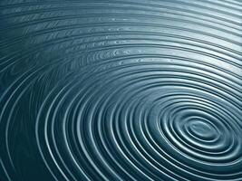 Rippling Water Texture with Concentric Waves in Dark Blue Tones photo