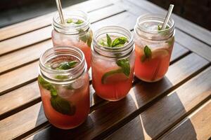 Refreshing Pink Lemonade in Mason Jars with Lime and Mint photo