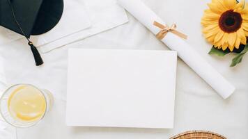 Graduation Cap with Blank Invitation Card for Celebrations photo