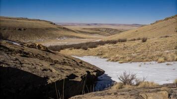 Serene Winter River in a Snowy Valley photo