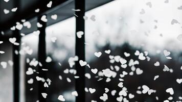 Bokeh White Hearts on a Glass Window at Night photo