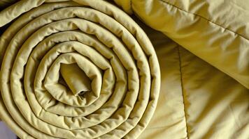 Rolled Yellow Blanket with Cozy Fabric Details photo