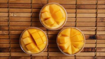 Freshly Cut Mango Cubes Served in Glass Bowls photo