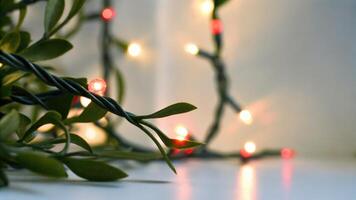 Christmas String Lights with Green Leaves photo