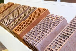 Samples of bricks on the showcase of a hardware store photo