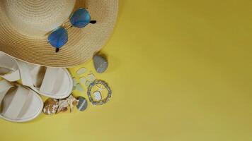 Summer travel vacation mood layout lifestyle spa wellness concept with beach accessories, copy space. Top view flat lay background, including straw hat, sunglasses, sandals, seashells and pebbles photo