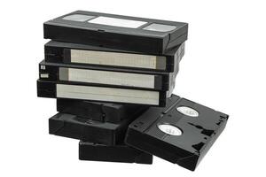 Pile of classic VHS tapes in black cases, nostalgic retro media storage collection photo