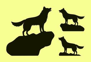 Set of four isolated silhouettes of wolves standing on rocks vector