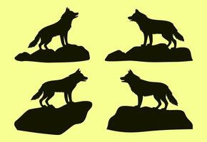 Set of four isolated silhouettes of wolves standing on rocks design vector