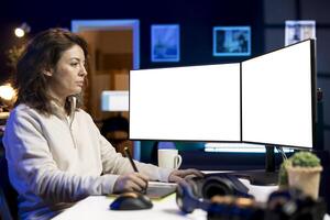 Photographer using photo editing software on mockup multi monitors setup to improve images quality. Photo editor utilizing specialized photographs retouching application on isolated screen displays