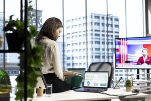Ambitious female leader developing a new business plan, showcasing her expertise in target analysis, strategic thinking and commitment to achieving company objectives. Decision making. photo