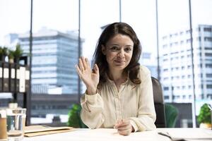 Woman director attending a videocall conference with the advisory board, planning a new investment during decision making meeting online. Shareholders with executive power and CEO discuss target. photo