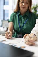 HR employees identifying right candidates for job opening, reviewing application materials to determine candidate qualifications. Recruiters doing screening process, selecting skilled people photo