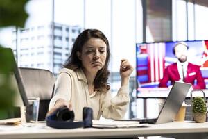 Powerful female leader grabbing her headphones for productivity in a smart office, highlighting the importance of respect, networking and effective communication to drive corporate results. photo
